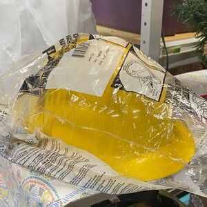 Yellow hard hat new in plastic with parts